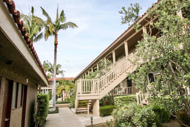 A sunny day outside the Casa La Vera community with stairs and trees