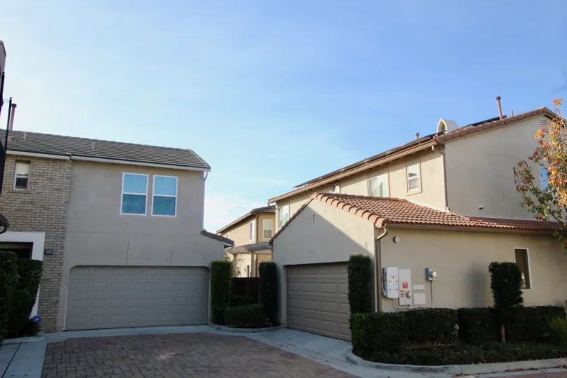 Two large pink buildings with garage doors inside Casita located in Orange CA