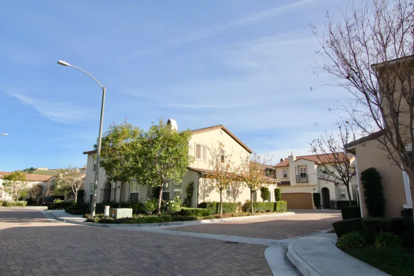 Beautiful neighborhood house with two stories and a lush green front yard