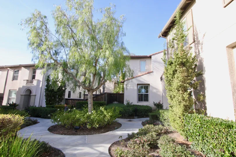 Beautiful neighborhood house with two stories and a lush green front yard