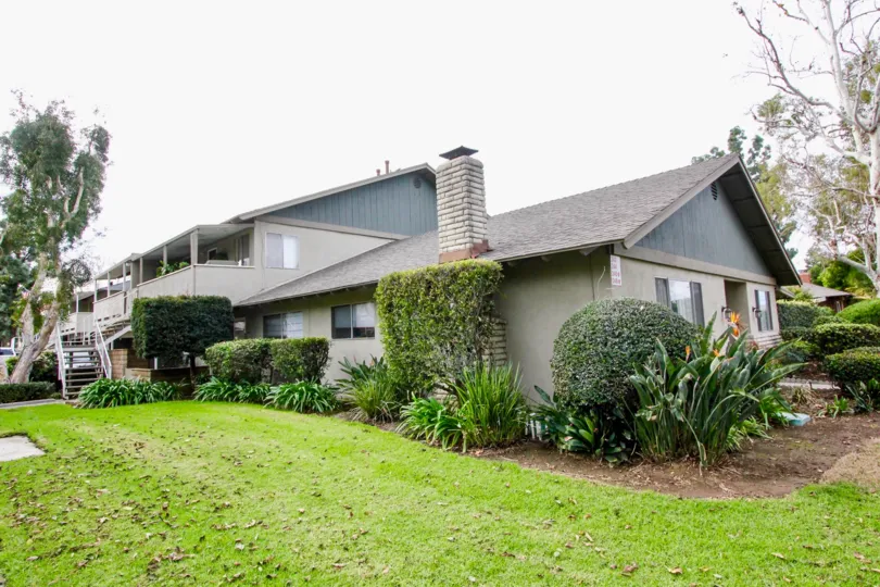 Beautiful neighborhood house with two stories and a lush green front yard
