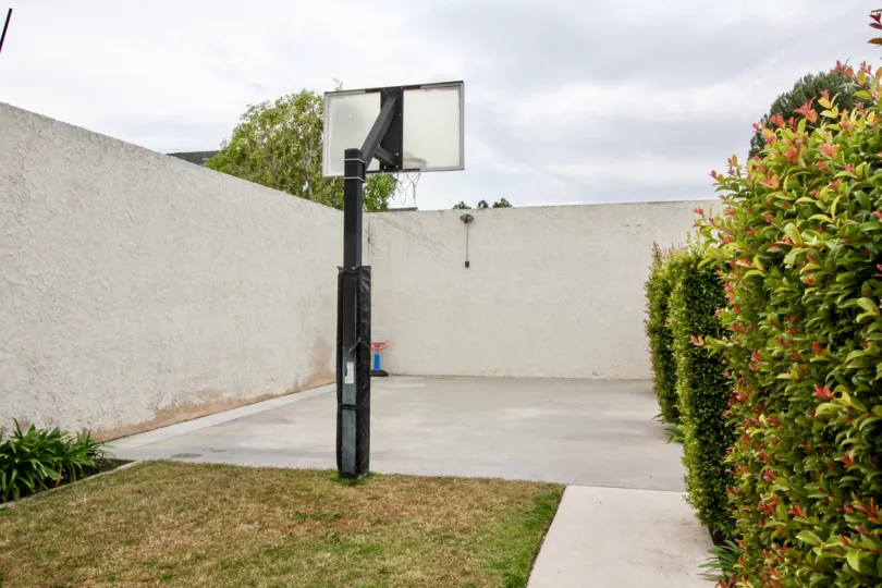 The basketball court in Fletcher Avenue community with a fence