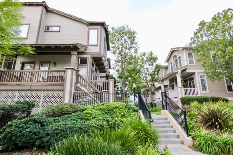 Beautiful neighborhood house with two stories and a lush green front yard
