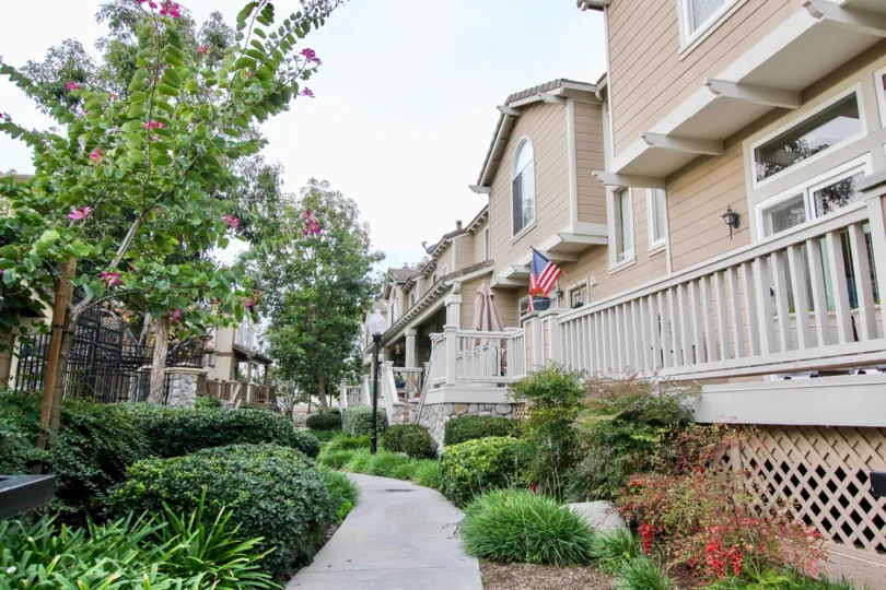 Beautiful neighborhood house with two stories and a lush green front yard