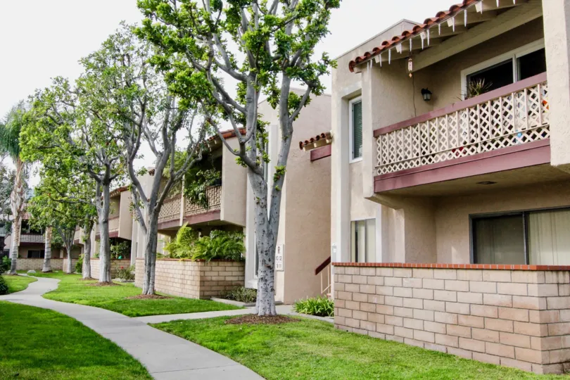 This is a picture of Trees next to an Apartment Complex in Orange, CA