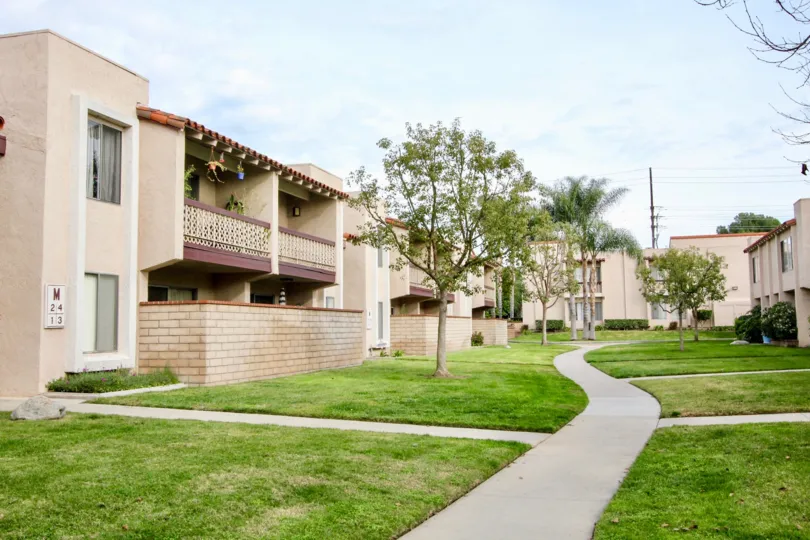 The green lawn of the La Veta Monterey community with trees