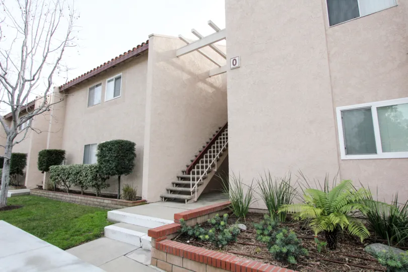 Beautiful neighborhood house with two stories and a lush green front yard