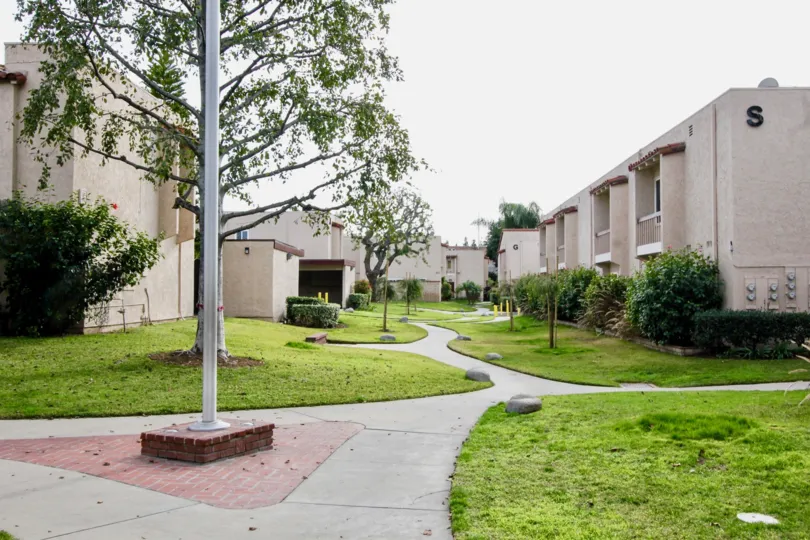 Beautiful neighborhood house with two stories and a lush green front yard