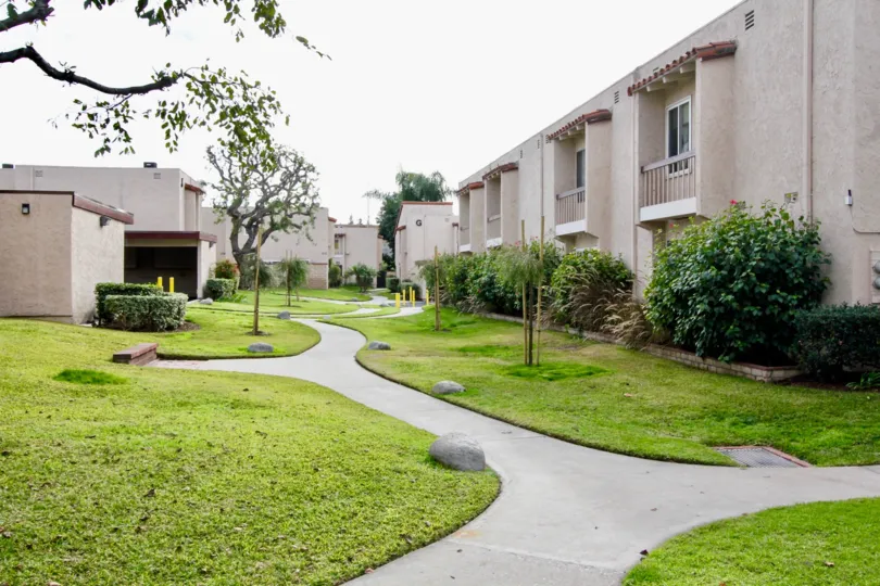 Beautiful neighborhood house with two stories and a lush green front yard