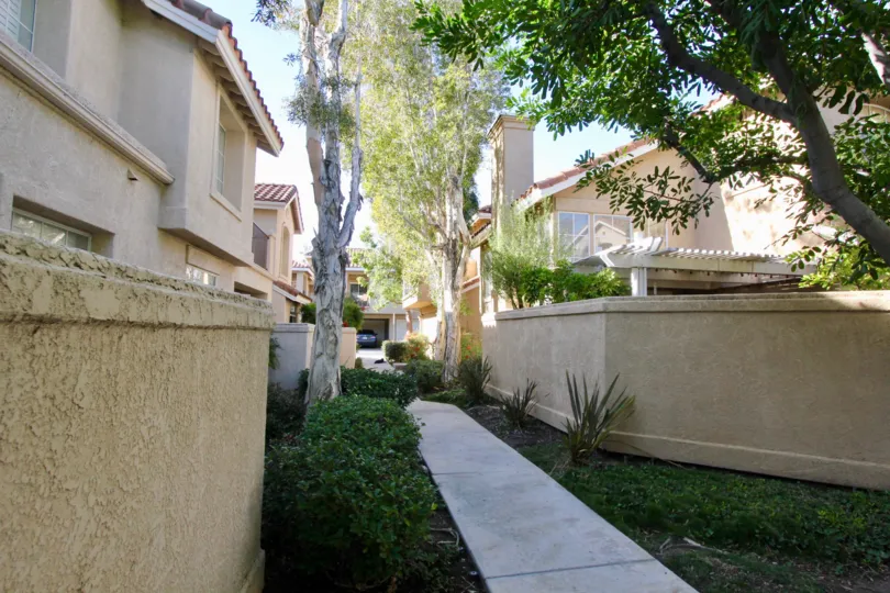Beautiful neighborhood house with two stories and a lush green front yard