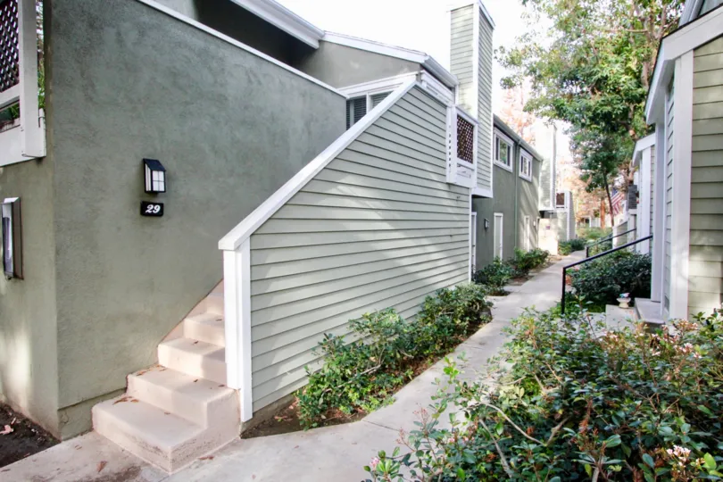 Beautiful neighborhood house with two stories and a lush green front yard
