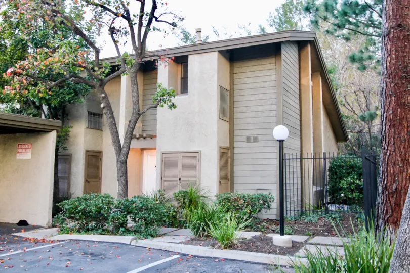 Beautiful neighborhood house with two stories and a lush green front yard