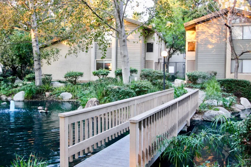 A wooden bridge over the water in the Orange Lakes Orange, CA