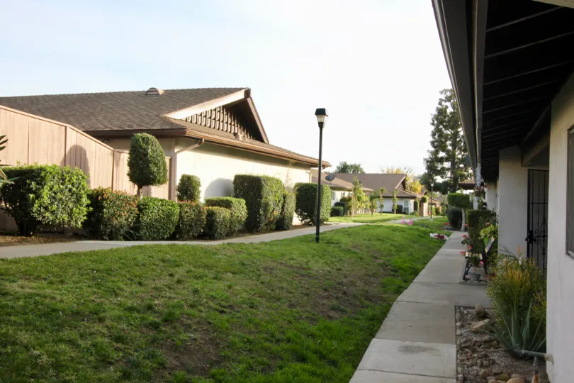 Beautiful neighborhood house with two stories and a lush green front yard
