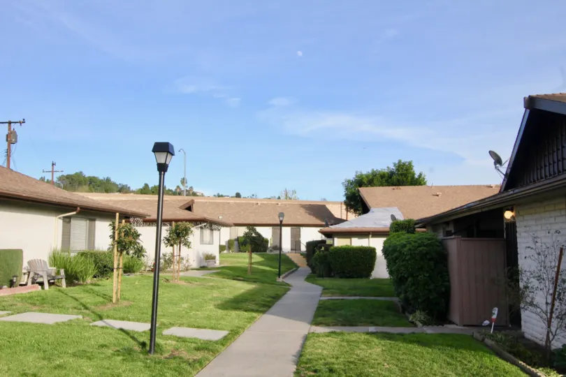 Old fashioned light poles line a sidewalk inside Park 72 in Orange CA
