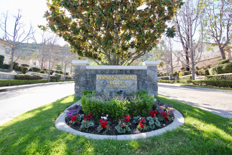 A stone welcome sign in Rocking Horse Ridge community Orange, California.