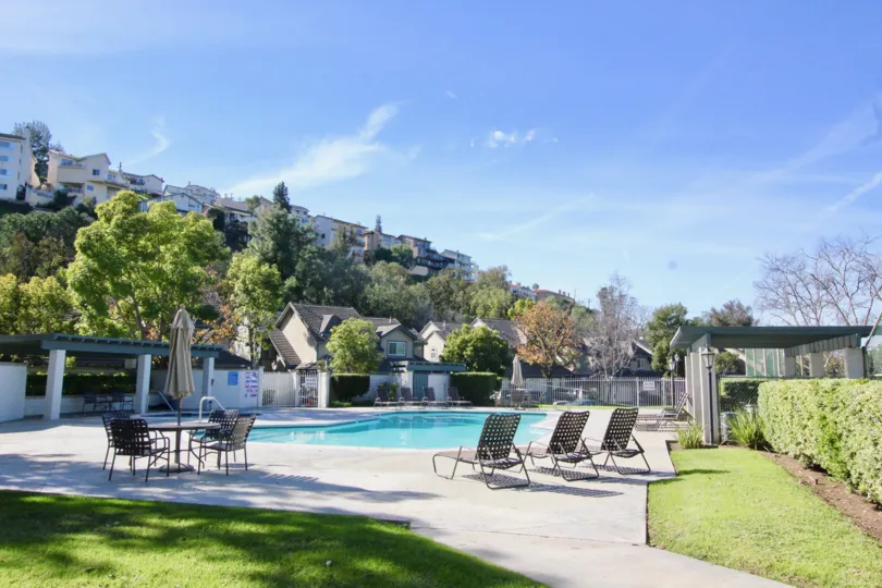 A clear day in the Stonehenge with a swimming pool and lawn.