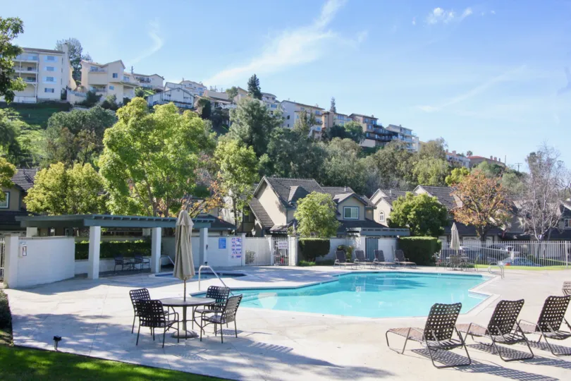 Stonehenge swimming pool nestled among forested hill in Orange, California