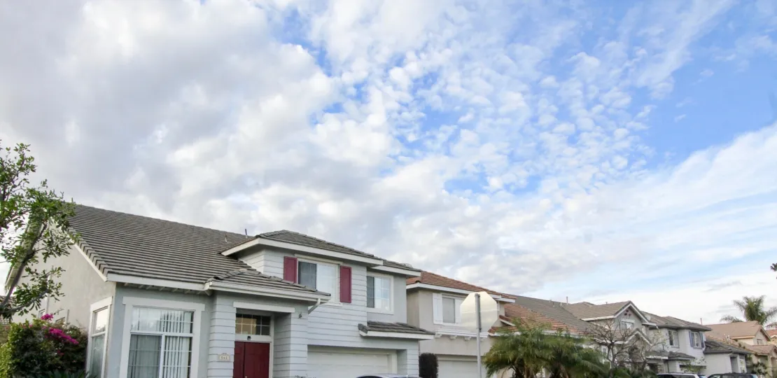 A white home in the Sycamore crossing community on a cloudy day