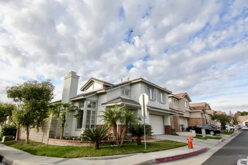 Spacious homes with many windows and manicured lawns in Sycamore Crossing.