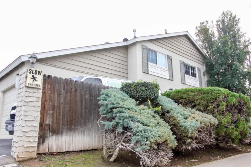 A wooden fence in front of a home in The Californian Orange, CA.