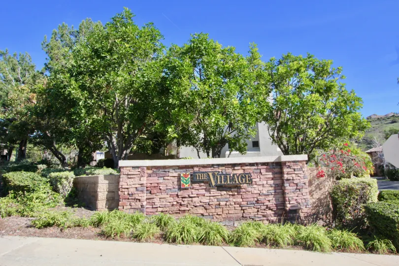 Lush landscaping welcomes you to The Village in The Village.