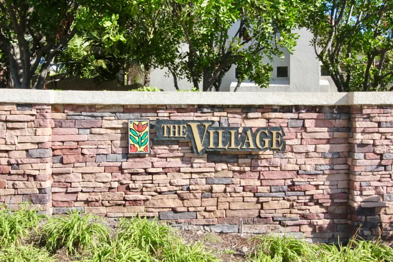 compound wall have letters the village in The Village
