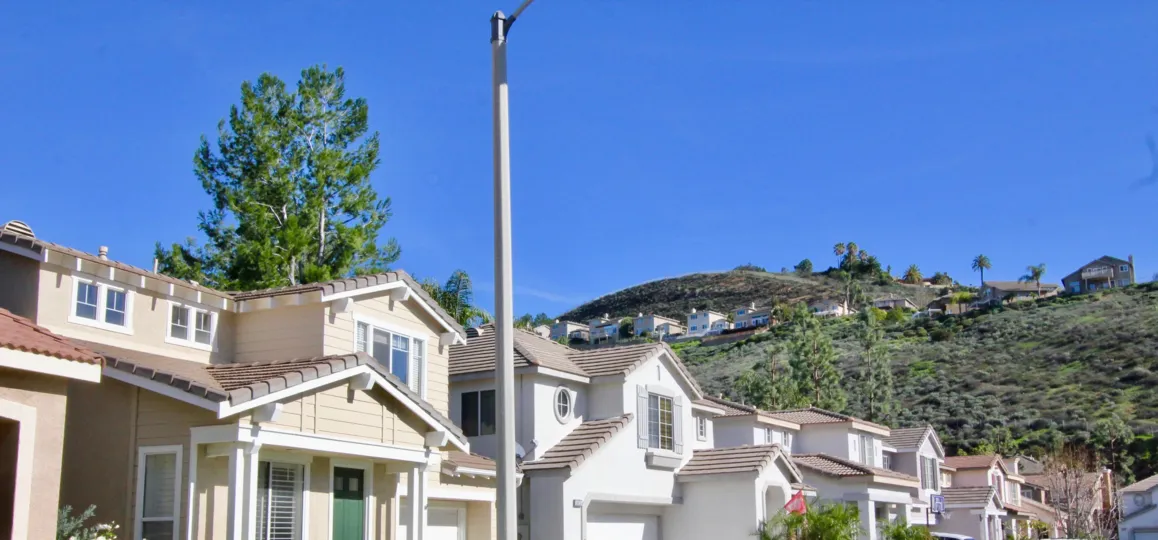 Beautiful neighborhood house with two stories and a lush green front yard