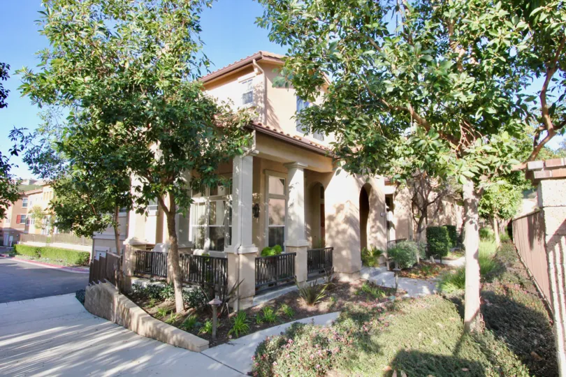 A big house with a large porch surrounded by trees in the Tremont community