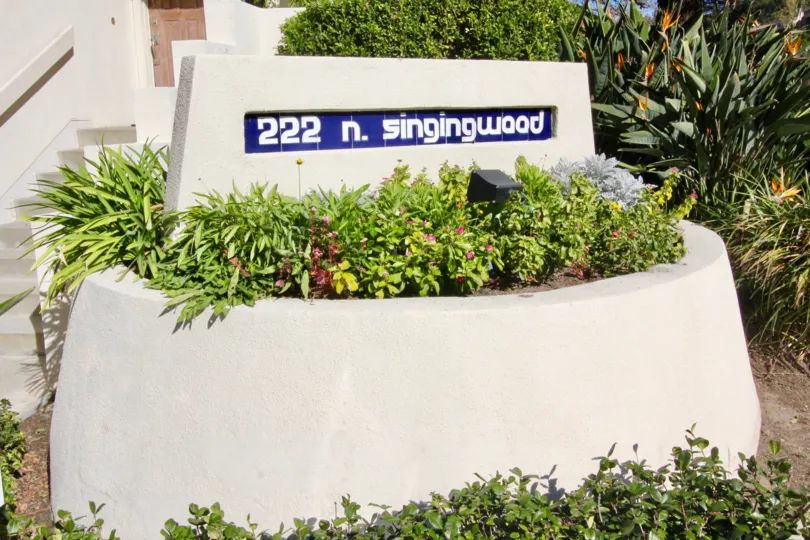 A morning in the Villeurbanne with a sign and garden.
