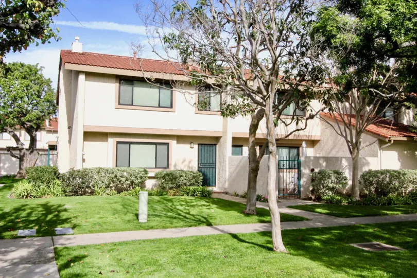 yard with trees and plant in front of the building in Vista Monterey