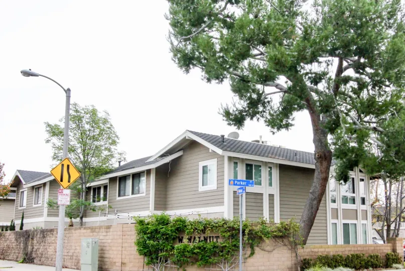 Vains covering the Wallnut Village sign in Orange, California