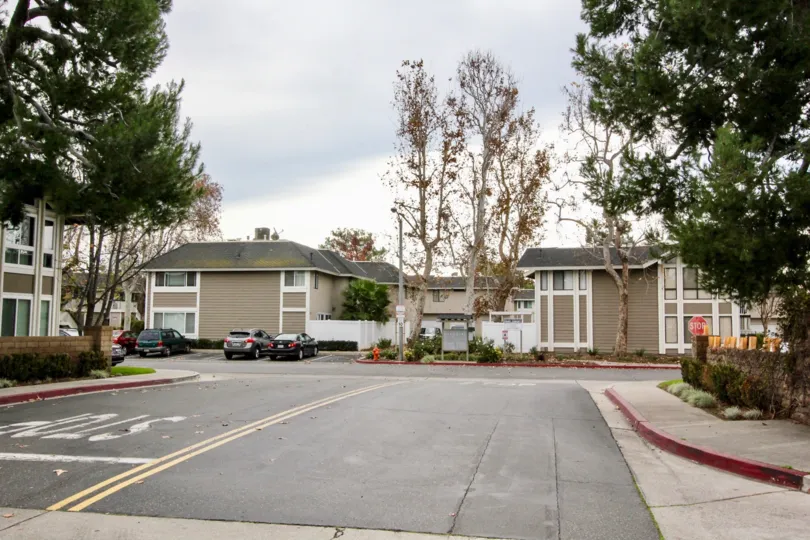 Brown and white condo units sit at the end of a street inside Walnut Village in Orange CA