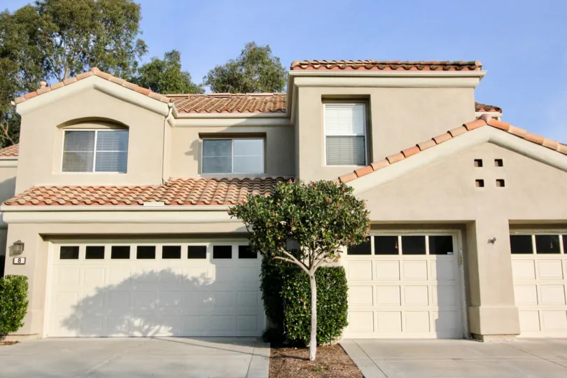 A sunny day in the area of Alicante, garage, condo, outside, trees, bushes, windows, roof