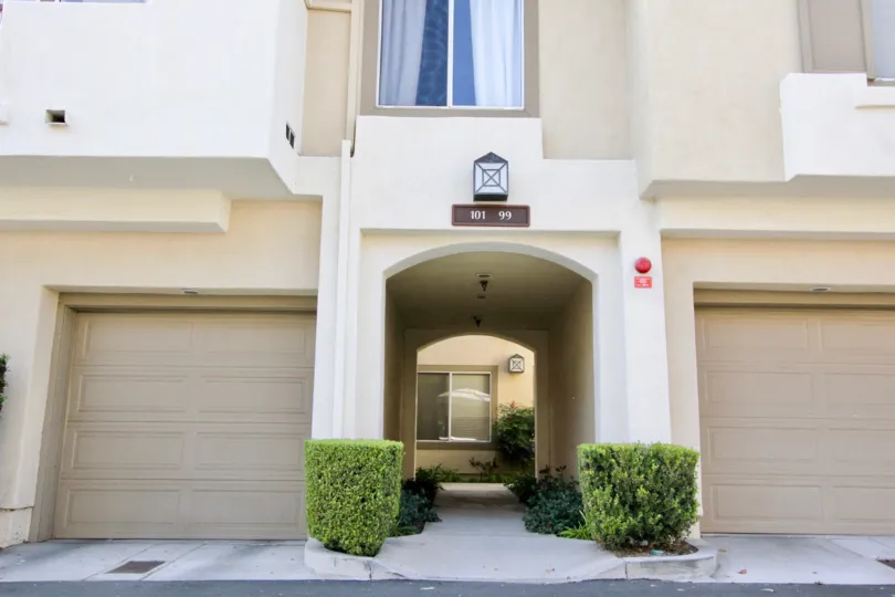 Arched entrance and garages to Cabo Vista community.