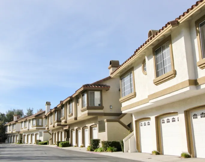 Multi family housing with tiled roofs and garages Rancho Santa Margarita, California's community of Casafina