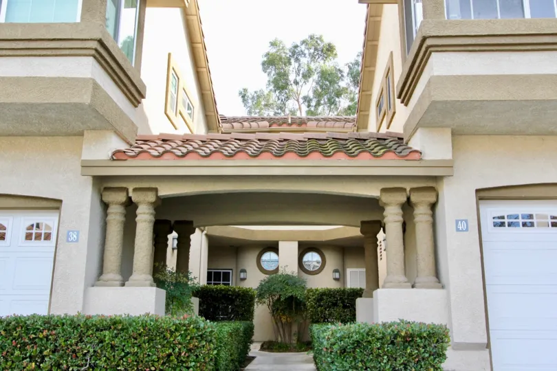 A walkway with hedges in Casafina in Rancho Santa Margarita, CA