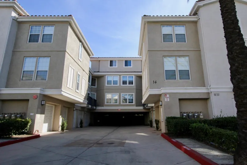 A sunny day at a Cierra Del Lago apartment complex with multiple windows being seen on the buildings
