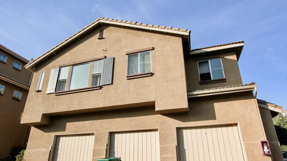 Garages and blue sky in Dakota in Rancho Santa Margarita, CA