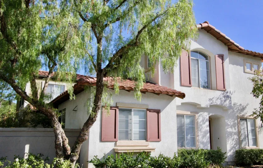 Tree and front face of home in Fiesta in Rancho Santa Margarita, CA