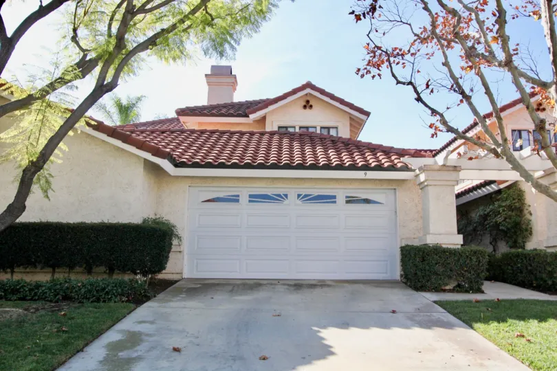 A street view of a residence in Floramar, in Rancho Santa Margarita, California, underneath a sunny sky