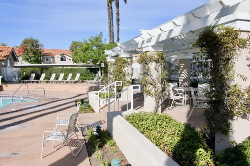 Chairs and pool at Las Flores in Rancho Santa Margarita, CA