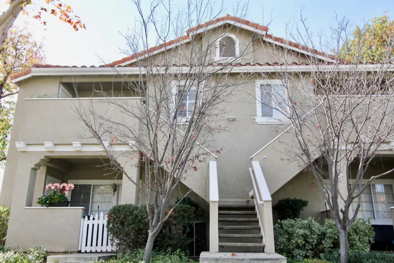 The exterior stairs of two units in the Las Flores community in Rancho Santa Margarita, CA on a sunny day