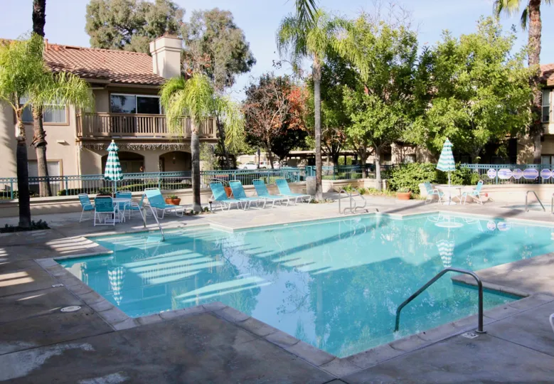 A sunny day pool side at the Los Portillos community.