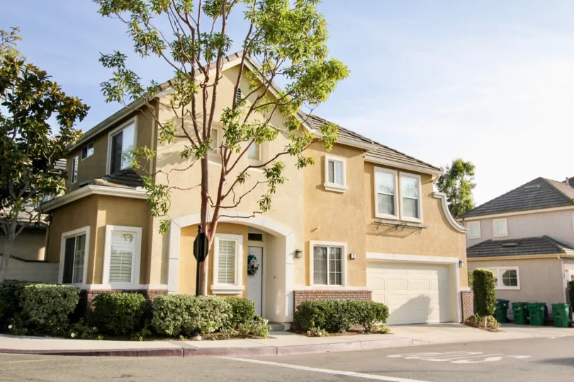 A large two story tan home with garage in Magnolia community in Rancho Santa Margarita, California.