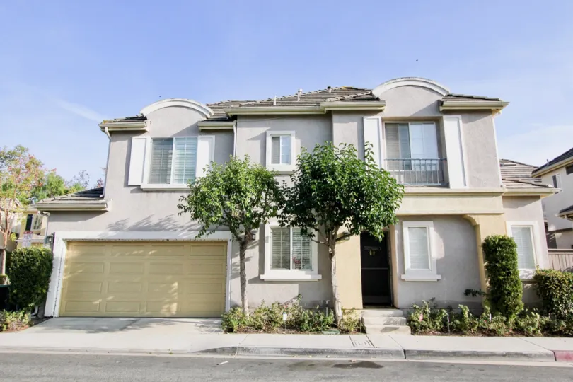 A sunny day in the area of Magnolia, condo, tree, grass, door, garage, window