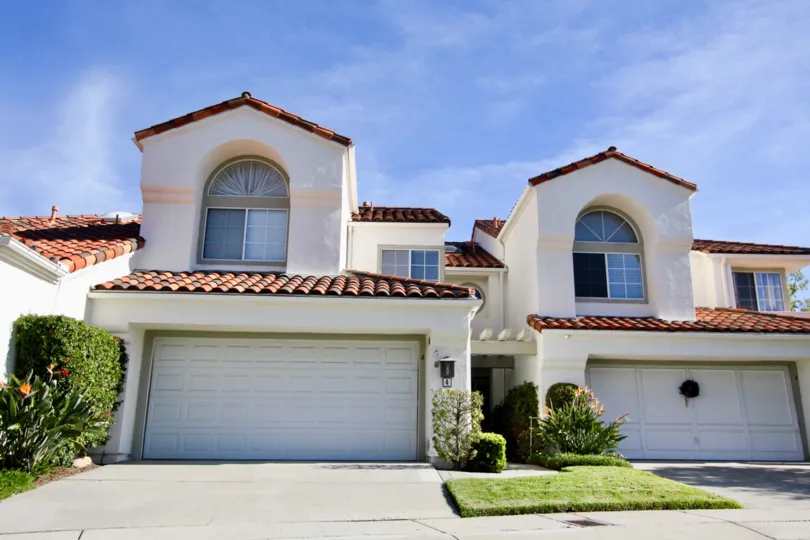 Two white homes with garages in Marbella community in Rancho Santa Margarita, California.