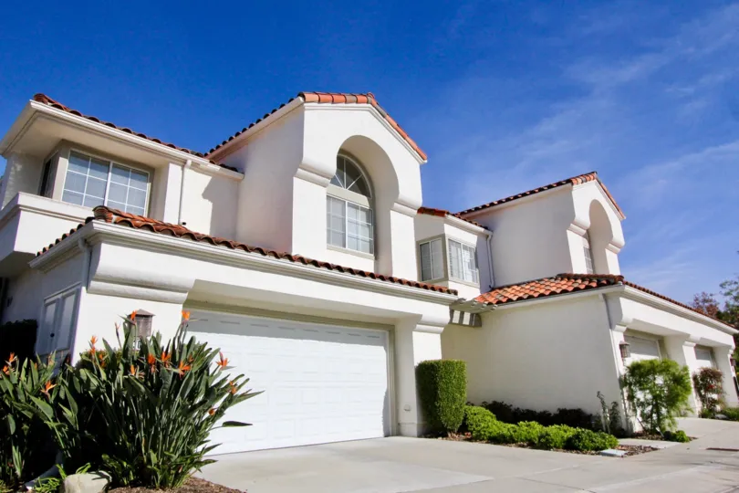 A sunny day in the area of Marbella, condo, outside, garage, flowers, windows, roof