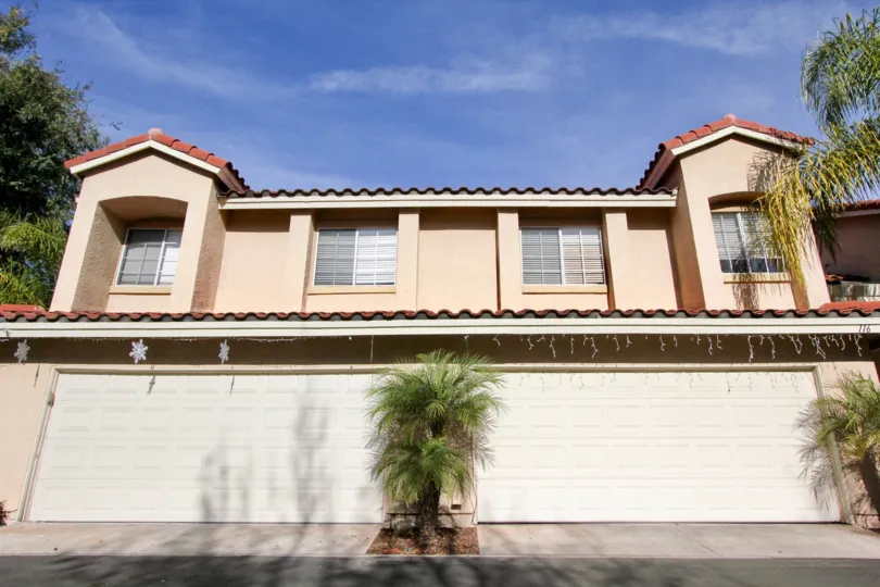 A sunny day in the area of Mission Greens, condo, garage, palm trees, windows, sky