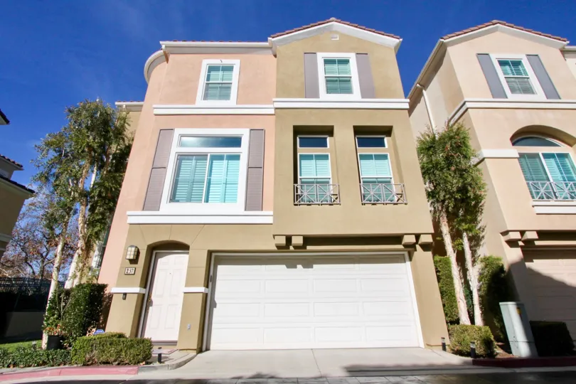 A sunny day in the area of Montana Del Lago, condo, outside, trees, garage, door, window